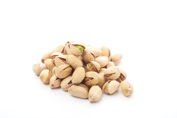Heap of pistachios nuts isolated on the white
