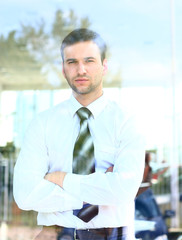 business man looking through window