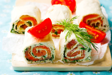  flat  bread roll with cream cheese and salmon