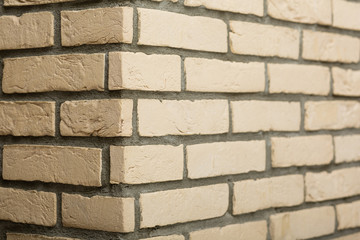 Corner of sandstone brick wall