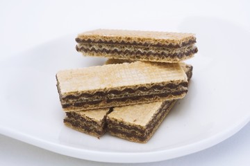 Wafers chocolate in cup on  white background