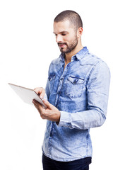 Casual man using a tablet computer, isolated on white background