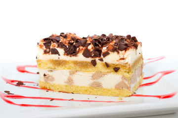 Piece of pineapple cake cream on white