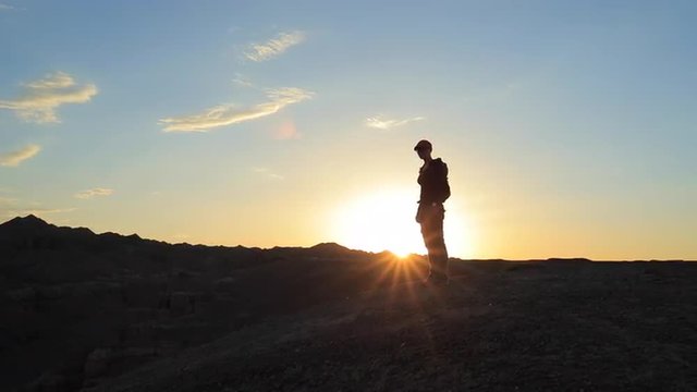 Young girl walking through the Canyons at sunset
