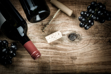 Setting with bottle of red wine, grape and corks. Wine list conc - 101031664