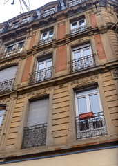Fototapeta na wymiar Facade of a building with balconies in Strasburg