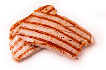 Cooked Yellowfin tuna fish steaks isolated on a white background