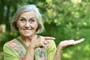 Fototapeta premium senior woman in summer park