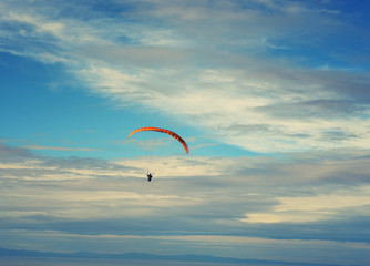 Paragliding in tandem against clear blue sky extreme sport background image