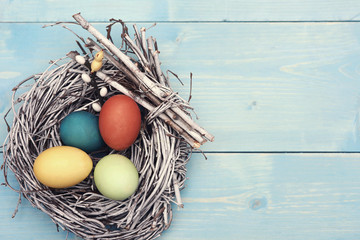 Easter nest with multi colorful eggs - obrazy, fototapety, plakaty