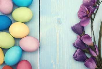 Branch of lilac flower and colorful easter eggs