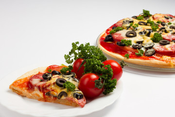 Pizza with tomatoes, salami, cheese and olives