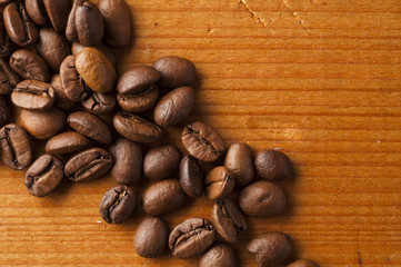 Coffee beans on wooden background
