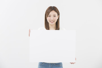 Fototapeta premium メッセージボードを持つ女性