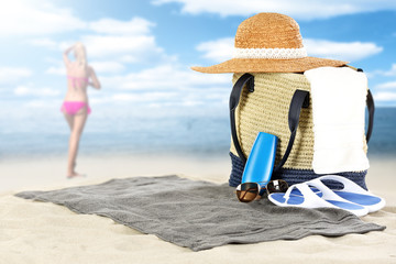 summer bag and woman on sand 