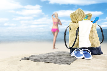 summer bag and woman on sand 