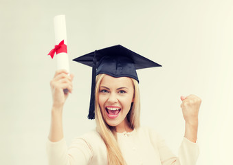 student in graduation cap with certificate