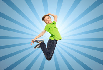 Fototapeta na wymiar smiling boy jumping in air