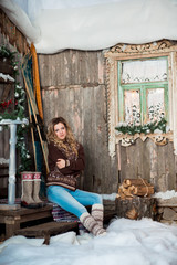 girl with Christmas around porch