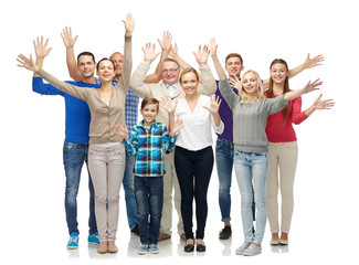 Obraz premium group of smiling people waving hands