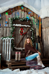 girl with Christmas around porch