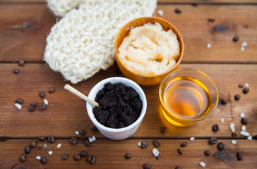 close up of coffee scrub in cup and honey on wood
