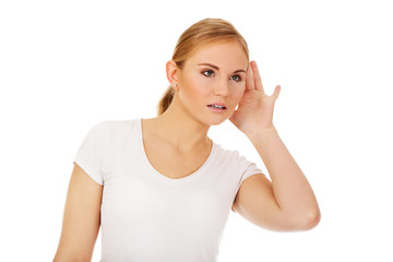 Shocked young woman overhears conversation