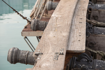 iron cannon on sail ship