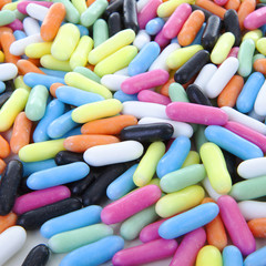 background of colorful laces rods candy in closeup