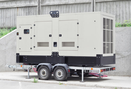 Mobile Diesel Generator on the Office Building Wall 