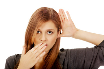 Shocked teenage woman overhears conversation