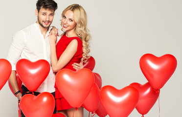 Fototapeta na wymiar Portrait of cute couple with balloons heart