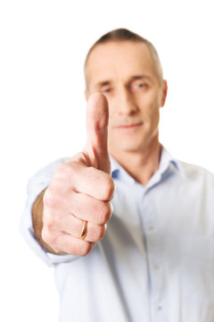 Mature man gesturing ok sign