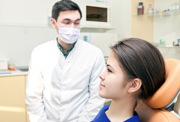 examination at the dentist's office. patient and dentist