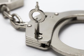 Close-up of key in handcuffs