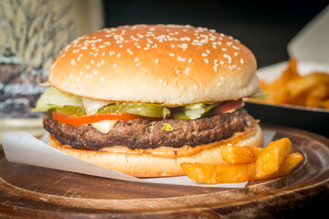 Cheeseburger served  with French Fries and Beer