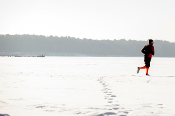 Fototapeta na wymiar Winter running, Winter jogging, outdoor winter activities 