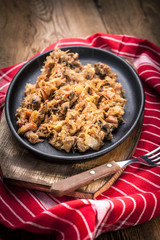 Traditional polish sauerkraut (bigos) with mushrooms and meat.