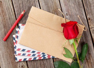 Valentines day letter and red rose