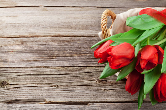 Red tulips in basket