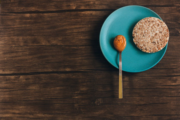 Peanut butter on old wooden table