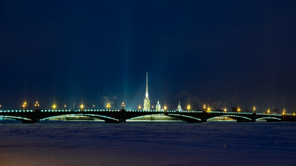 Fototapeta na wymiar Peter and Paul Fortress and Troitskiy bridge at night, Saint-Petersburg, Winter, Russia