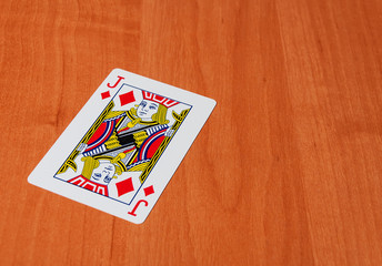 Plastic poker cards on wooden background