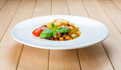 Traditional italian pasta with aubergine and zucchini
