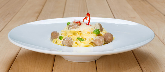 Traditional italian pasta with meatballs