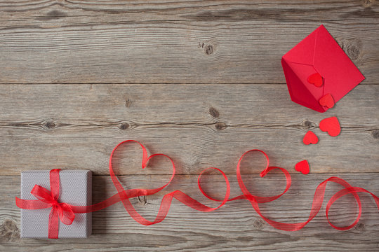 Gift on Valentine's Day, red hearts ribbon