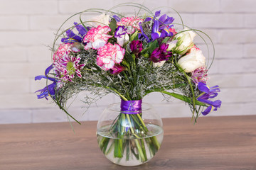 bouquet of varios flowers in glass vase
