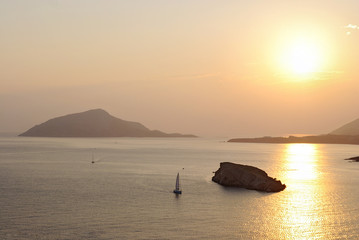 The magnificent golden sunset on the Aegean Sea at Cape Sounion. Greece.