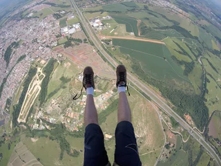 Fototapeten Skydiving point of view of my shoes untied © Mauricio G