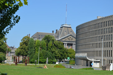 Green park at the university of Brussels, with modern ellips formed building